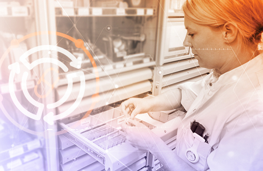 Researcher organizing medical bottles