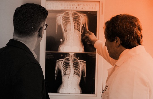 Doctor talking to a patient about an X-ray graph