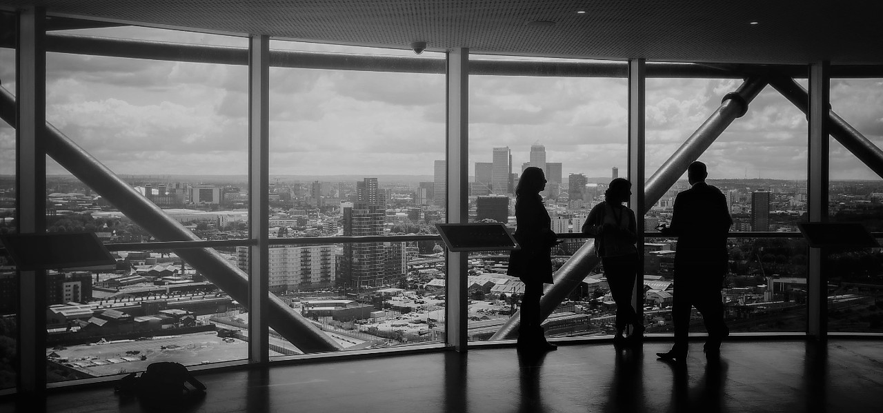 People Enjoying the View and Discussing Business