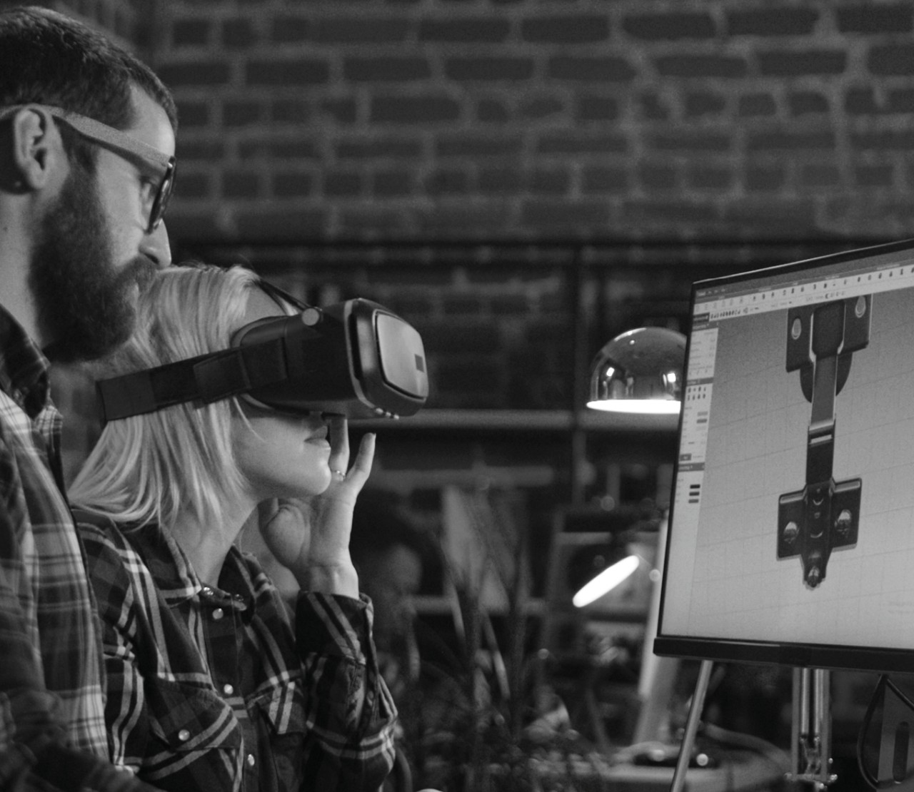 Two people testing and working on a video game