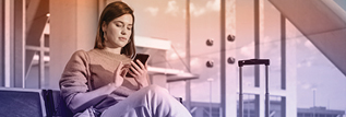A woman tapping on a phone