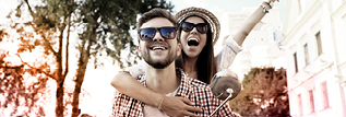 Happy couple travelling on a motorbike