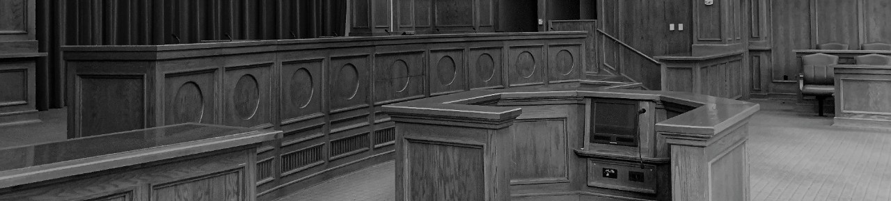 A gray-scale image of a law school courtroom, similar to ones where many Lionbridge legal interpreters studied.