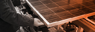 A person inspecting a solar panel