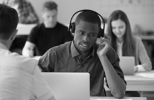 Employee talking on a headphone