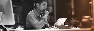 Man thinking before a laptop computer