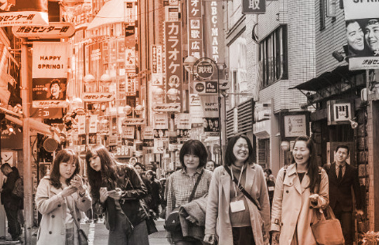 People walking down busy street